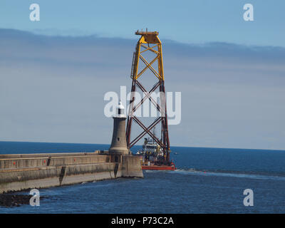 Newcastle Upon Tyne, 4th july 2018, Uk weather.Offshore subsea steel wind turbine foundation jacket (legs) been towed into the north sea at Tynemouth, North Tyneside, UK. Stock Photo