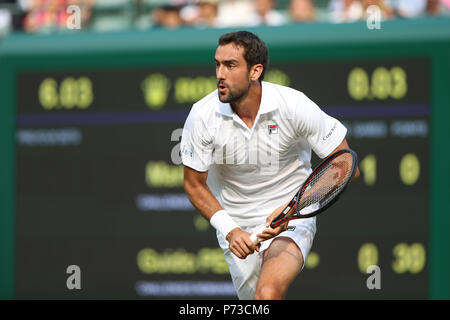 London, UK. 4th July 2018, All England Lawn Tennis and Croquet Club, London, England; The Wimbledon Tennis Championships, Day 3; Marin Cilic of Croatia chases down the drop shot and returns to Pella of Argentina Credit: Action Plus Sports Images/Alamy Live News Stock Photo