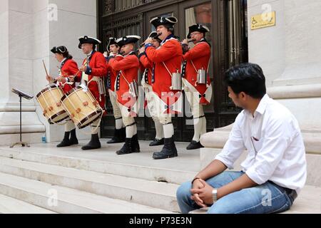 New York, USA. 4th July, 2018. A Fife and Drum Corps band performs on Wall Street across from the New York Stock Exchange at the The Fourth of July celebration which is also known as Independence Day. The Fourth of July is also known as Independence Day. Independence Day commemorates the signing and adoption of the Declaration of Independence on July 4, 1776, which gave the colonies independence. New Yorkers and visitors to the city flocked to the 9/11 Memorial and Wall Street in Lower Manhattan in celebration of the 242nd. anniversary on 4th. July, 2018. (Credit Image: © G. Rona Stock Photo