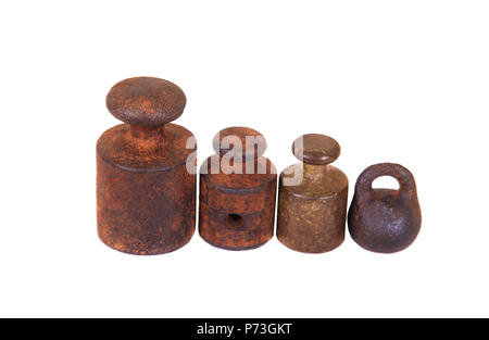 Old and rusty weights on white background close up. Stock Photo