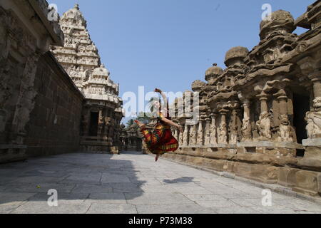 bharatha natyam,one of the eight classical dance forms of india,is from the state of tamil nadu.dancer poses before temples with sculptures Stock Photo