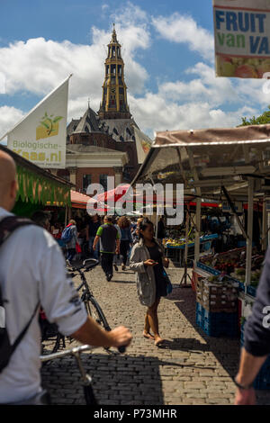 The market at the Vismarkt in the city center of Groningen with in the background the Aa-Kerk, one of the landmarks of the town, the Netherlands 2018. Stock Photo