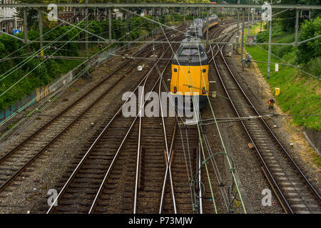 an intercity train is leaving railway station Groningen in the the direction of Zwolle, the Netherlands 2018. Stock Photo