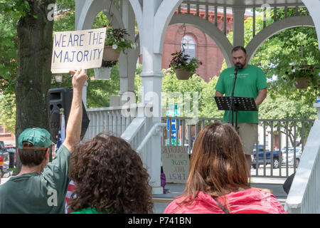 KEENE, NEW HAMPSHIRE/US - June 30 2018: Protesters hold signs at a rally protesting the immigration policies of the Trump administration. Stock Photo