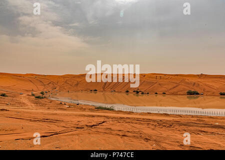 Lake Khararah south of Riyadh, Saudi Arabia. A popular spot to ride the red dunes with an AWD