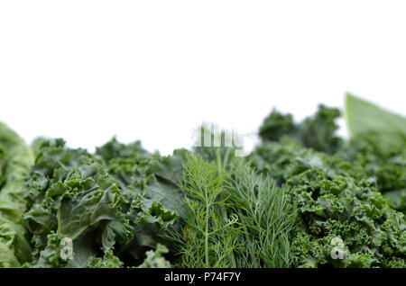 Top view flat layout of fresh culinary herbs and green leafy vegetables with copy space. Background for nutrition, food, health, diet and weight loss. Stock Photo