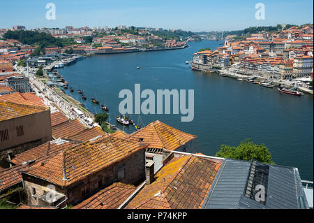 14.06.2018, Porto, Portugal, Europe - An elevated view of Porto's cityscape along the waterside of the Douro River. Stock Photo