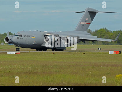 A C-17 Globemaster III, assigned to the 164th Airlift Wing, Tennessee Air National Guard, lands at Ämari Air Base, Estonia with Maryland Air National Guard personnel and equipment for Saber Strike 15, June 5, 2015. Saber Strike is an exercise that aims to continue to improve U.S., allied partners, and participating nations' interoperability, while increasing their capacity to conduct a full spectrum of military operations. Stock Photo