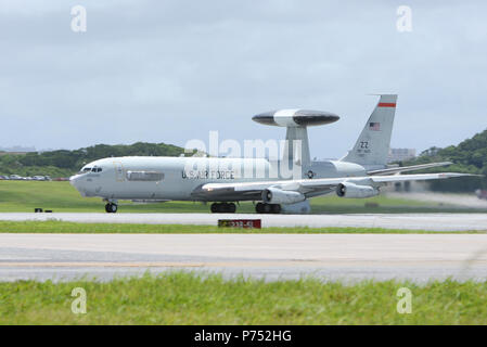 A U.S. Air Force E-3 Sentry Airborne Warning and Control System from the 961st Airborne Air Control Squadron taxis on the runway before takeoff from Kadena Air Base, Japan, to avoid damaging winds and debris from an approaching typhoon Aug. 21, 2015. Each time a typhoon moves too close to Okinawa, units across Kadena follow a standardized procedure to ensure maximum safety and security for all equipment and assigned personnel during the strong winds and debris associated with the storms. If it remains on course and at its current speed, Typhoon Goni is expected to hit Okinawa within the next f Stock Photo