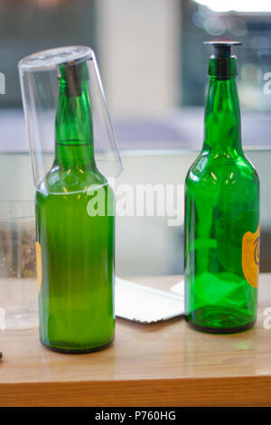 two bottles of cider on a wooden table Stock Photo