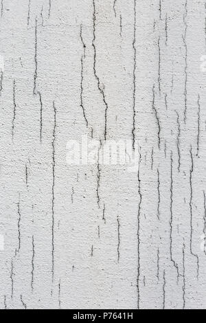 Texture of white dirty cracked wall. Small straight cracks. Direct fracture on painted surface. Cells fissure Stock Photo