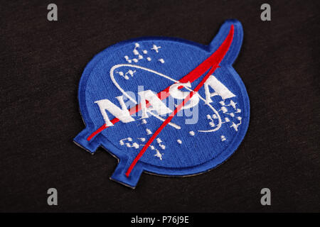 15 March 2018 - The National Aeronautics and Space Administration (NASA) emblem patch on black uniform background Stock Photo