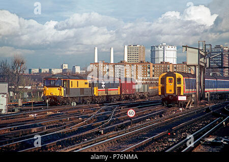 A pair of class 73 electro diesel locomotives numbers 73119 'Kentish Mercury' and 73103 double heading an engineers train at Clapham Junction on the 26th November 1993. Stock Photo