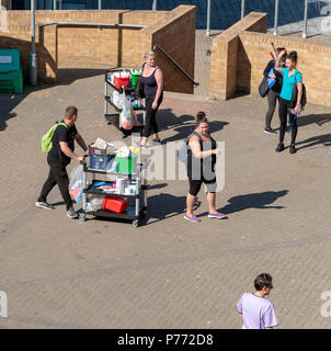 Housekeeping and cleaning team on route to an assignment on a university campus. Stock Photo