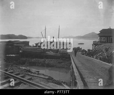 . English: Loading docks at the waterfront for handling lumber and supplies, Cordova , ca. 1908 . English: Construction photographs of the Copper River and Northwestern Railway along the Copper River from 1906-1911. PH Coll 375.6 Subjects (LCTGM): Loading docks--Alaska--Cordova; Harbors--Alaska--Cordova  . 1908 7 Loading docks at the waterfront for handling lumber and supplies, Cordova , ca 1908 (HEGG 739) Stock Photo