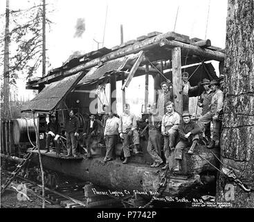 . English: Logging crew and donkey engine next to spartree, Florence Logging Company, ca. 1916 . English: Caption on image: Florence Logging Co., Silvana, Wash., Kinsey Photo, Seattle. No. 10 PH Coll 516.1274 The Florence Logging Company was in business ca. 1910 to ca. 1923. Silvana is a community six miles west of Arlington on the Stillaguamish River delta in northwest Snohomish County. Scandinavian influence was once strong there. In 1892, when a post office was established, the name used was Stillaguamish. The change to the present name was suggested by C. Jorgenson, who filed a plat for th Stock Photo