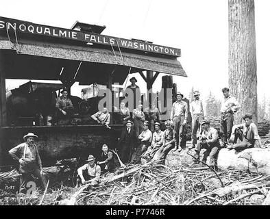 . English: Logging crew with electric donkey engine, ca. 1922 . English: Caption on image: Kinsey Photo No. 87 PH Coll 516.4111 In the early 1890s, the town of North Bend was called Snoqualmie, and the town of Snoqualmie was called Snoqualmie Falls. What is now Snoqualmie got its name - and the railway depot that was originally slated to go to North Bend - by wooing railway officials when North Bend's founder (land speculator Will Taylor, who platted the city) was out of town. To avoid confusion, railroad officials created rules against nearby towns sharing similar names and so 'forced (what i Stock Photo