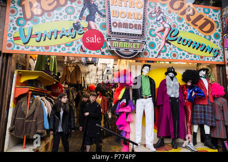 London, United Kingdom  - December 31, 2017: Fashion shop with costumes Camden Lock Market or Camden Town with people around in London, England, Unite Stock Photo