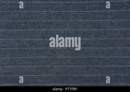 Striped blue denim jeans texture / pattern background. Close up from pants. Stock Photo