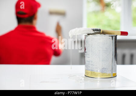 home improvement interior painting. paint brush with color bucket on the table Stock Photo