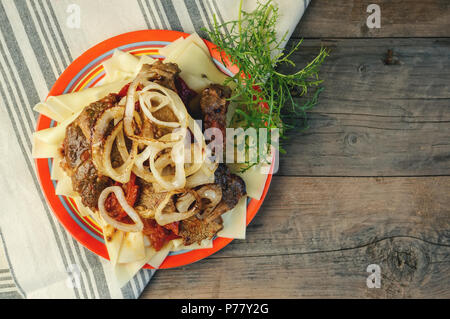Traditional dish of Turkic people in Central Asia Beshbarmak. Copy spase. Stock Photo
