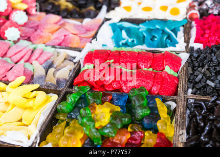 Varieties of sweets jelly bears and other patterns are depicted on this stand Stock Photo