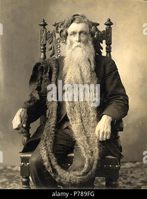 Hans Langseth (1846–1927) at age 66 seated in ornate chair with beard draped over his shoulder and down to his hand. 1912 or 1913 according to this 36 Hans Langseth