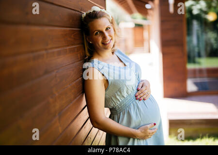 Beautiful blond pregnant woman Stock Photo