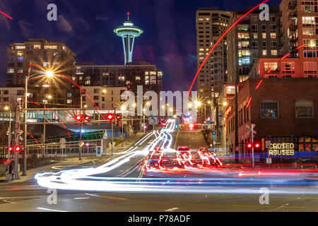 Light trails on the road at night with the The Space Needle in the distance ,Seattle ,Washington, USA Stock Photo