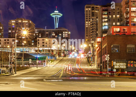 Light trails on the road at night with the The Space Needle in the distance ,Seattle ,Washington, USA Stock Photo