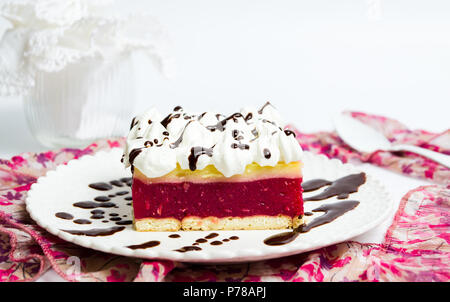 Cherry fruit cake with cream on a plate Stock Photo