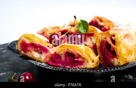 Homemade cherry sweet fruit pie slices on a plate
