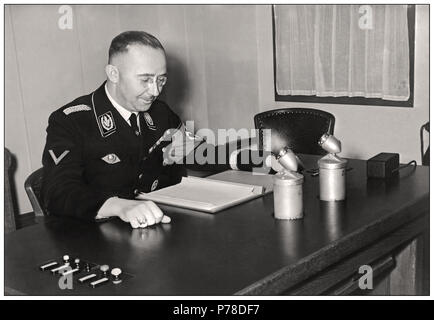 HIMMLER BROADCAST SPEECH BERLIN Vintage WW2 Archival photo image 1939 of Heinrich Himmler (1900-1945), who reorganized the SS (Special Section) from 1929 on the basis of racial selection and became head of the Gestapo and SA (Assault Sections ,1934), he organized and maintained the German Nazi extermination concentration camps. Arrested by the British, he poisoned himself (before his inevitable execution for war crimes against humanity) in 1945. Stock Photo
