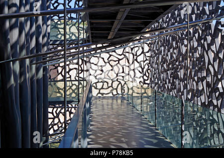 Marseille, MuCEM, View of the public pedestrian ramp between the outer latticework shell & the building itself, linking all floors Stock Photo
