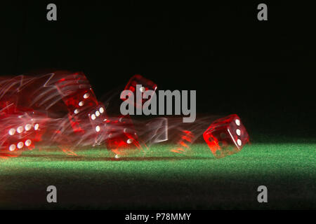 Rolling casino dice Stock Photo