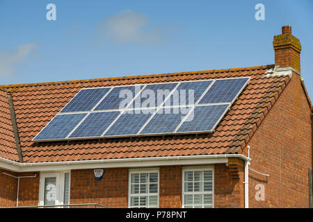 Close up of solar panels on the roof of a new detached house Stock Photo