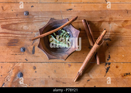 Cinnamon and pepper arranged on a old table Stock Photo