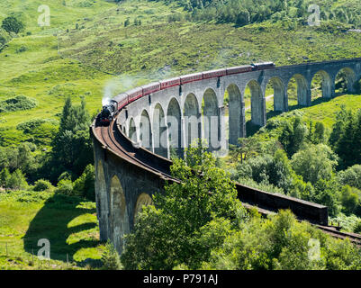 The Jacobite Express also known as the Hogwarts Express crosses the Glenfinnan Viaduct on route between Fort William and Mallaig. Stock Photo