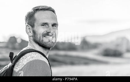 Portrait of a man in a hike in monochrome tones. Stock Photo