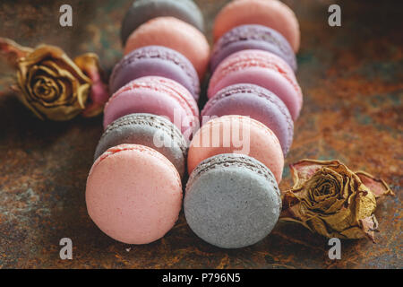 Freshly baked multi-colored macaroons close-up, selective focus. Stock Photo