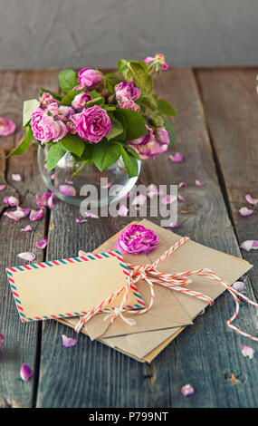 Blank greeting card, romantic letters in a craft envelope on a beige ...