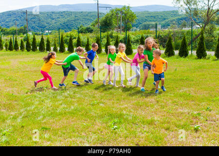 Active children playing yard games Stock Photo