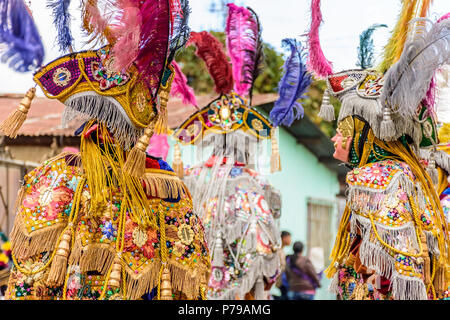 Parramos, Guatemala - December 28, 2016: Traditional folk dancers in masks & costumes perform Dance of the Moors in village near Antigua Stock Photo