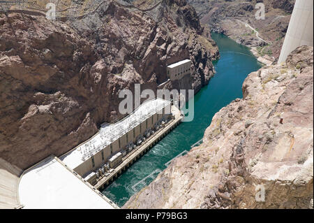High Angle View Looking Down at Green Water of Colorado River from Hoover Dam, a Popular Tourist Attraction in Black Canyon on Border of Arizona and N Stock Photo