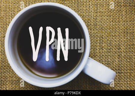 Handwriting text writing Vpn. Concept meaning Secured virtual private network across confidential domain protected Mug coffee thoughts ideas creative  Stock Photo