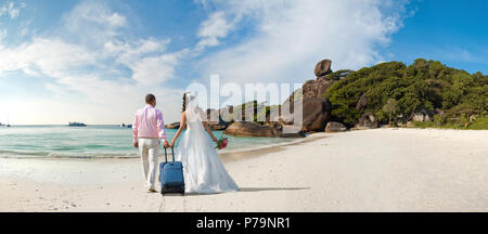 happy newly married couple  in honeymoon, on sun sandy beach in Thailand Stock Photo