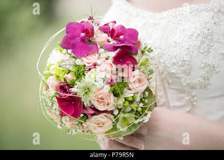A bride holding her bridal bouquet, Austria