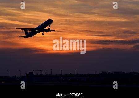 Silhouette, airplane taking off at sunset, Munich Airport, Upper Bavaria, Bavaria, Germany Stock Photo