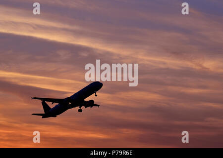 Silhouette, airplane taking off at sunset, Munich Airport, Upper Bavaria, Bavaria, Germany Stock Photo
