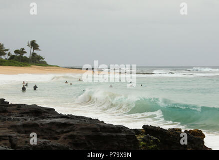 Sandy Beach with surfers and swimmers. Sandy Beach, Halona Cove, Oahu Island, Hawaii, USA. Stock Photo